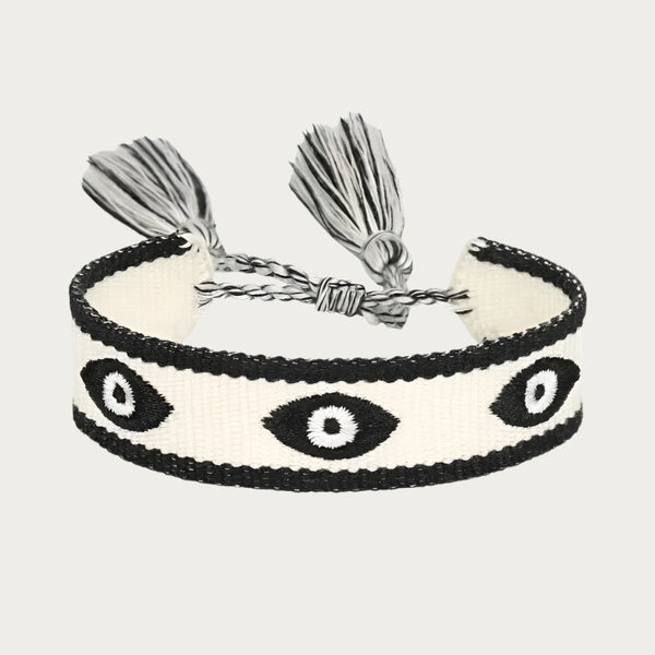 Black and white cotton bracelet with eye symbols inspired by Brazilian summer style.