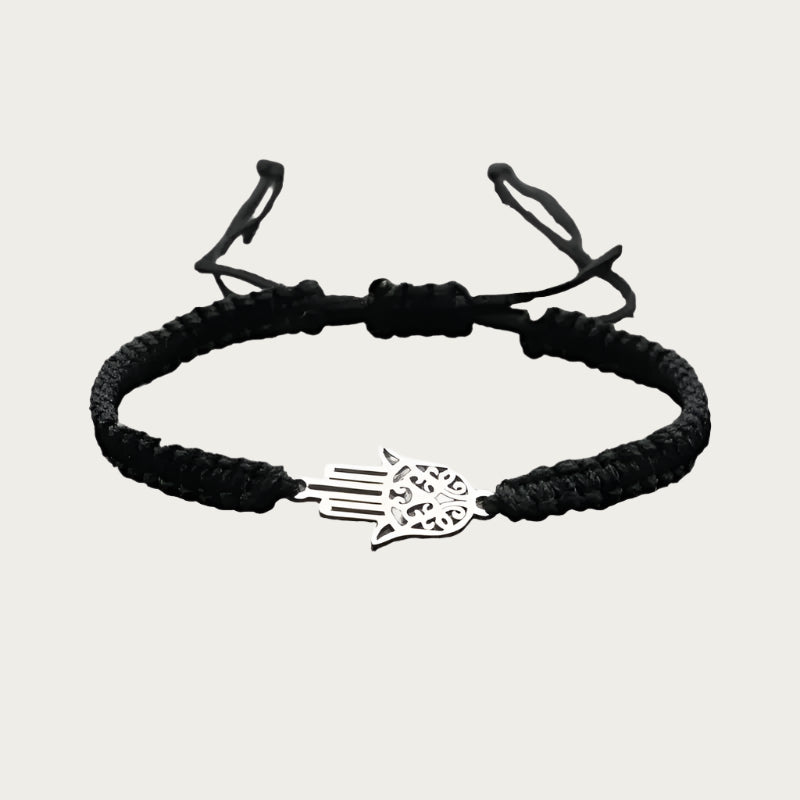 Red braided bracelet with stainless steel Hamsa pendant inspired by Brazilian summer and protection symbols.